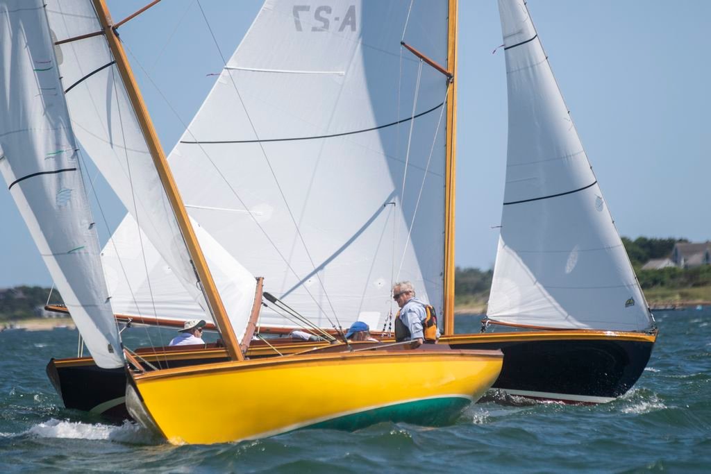 Peter Thomas on the Alerion Second Wind in close quarters during one-design racing Saturday, the first day of Nantucket Community Sailing's 2019 Race Week.