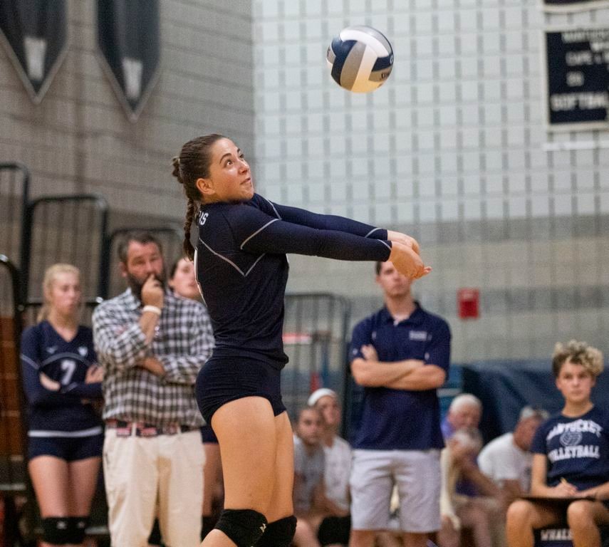 Tessa Dougan bumps the ball in the varsity volleyball team's season opener at home against Frontier Sunday.