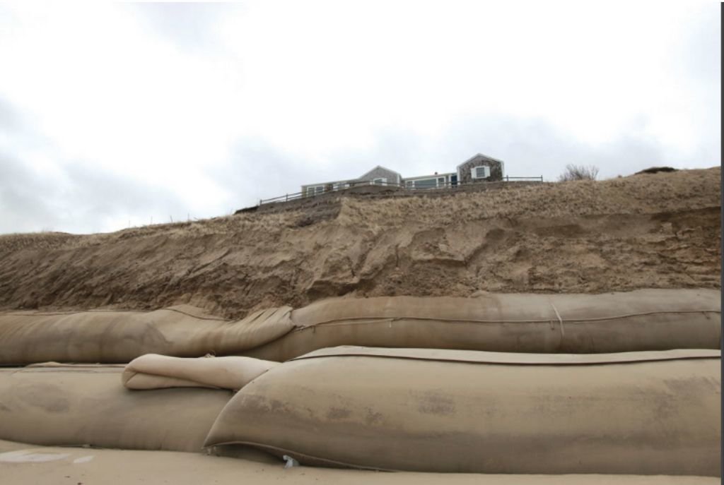 Geotextile tubing along 1,000 feet of the base of the Sankaty Bluff intended to protect the homes above from erosion.