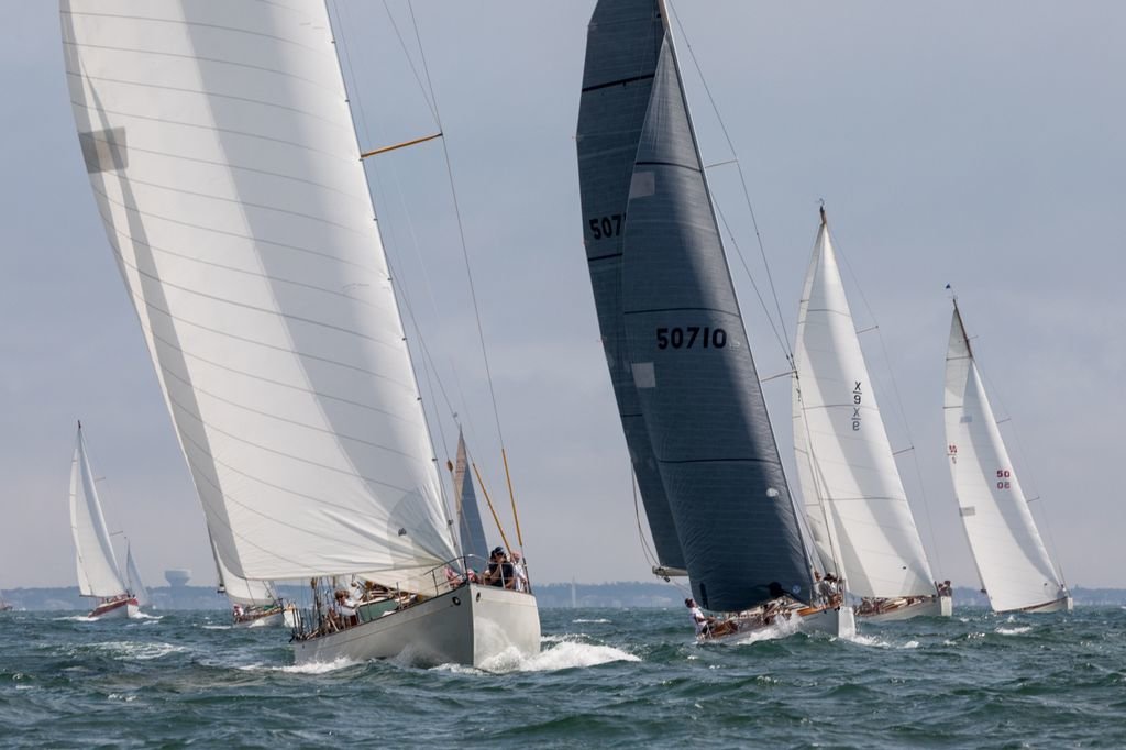 A group of boats finally catch a breeze upwind during Sunday's Opera House Cup wooden-sailboat race off Nantucket.