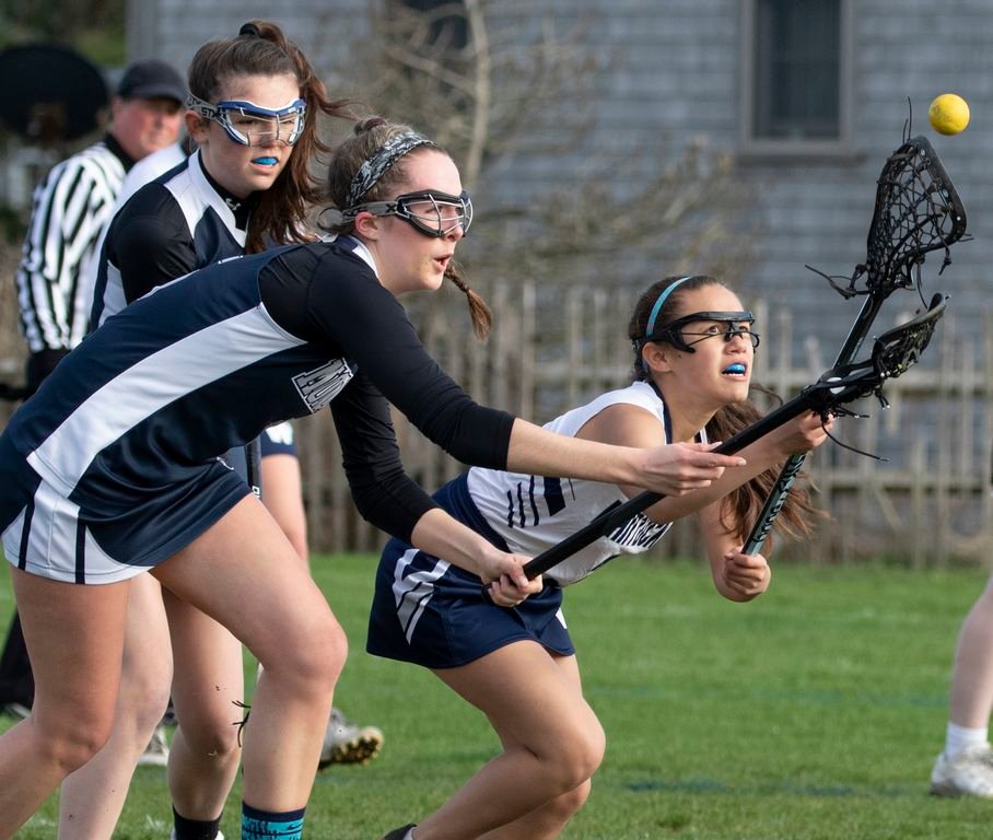 Joselin Pineda, right, goes for the ball in Nantucket's 13-12 loss to the Monomoy Sharks Tuesday afternoon.
