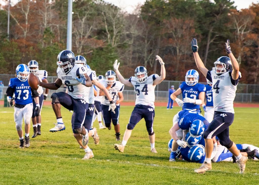Torane Burton high-steps into the end zone while Jack Wilson celebrates in Nantucket's playoff win over Mashpee.