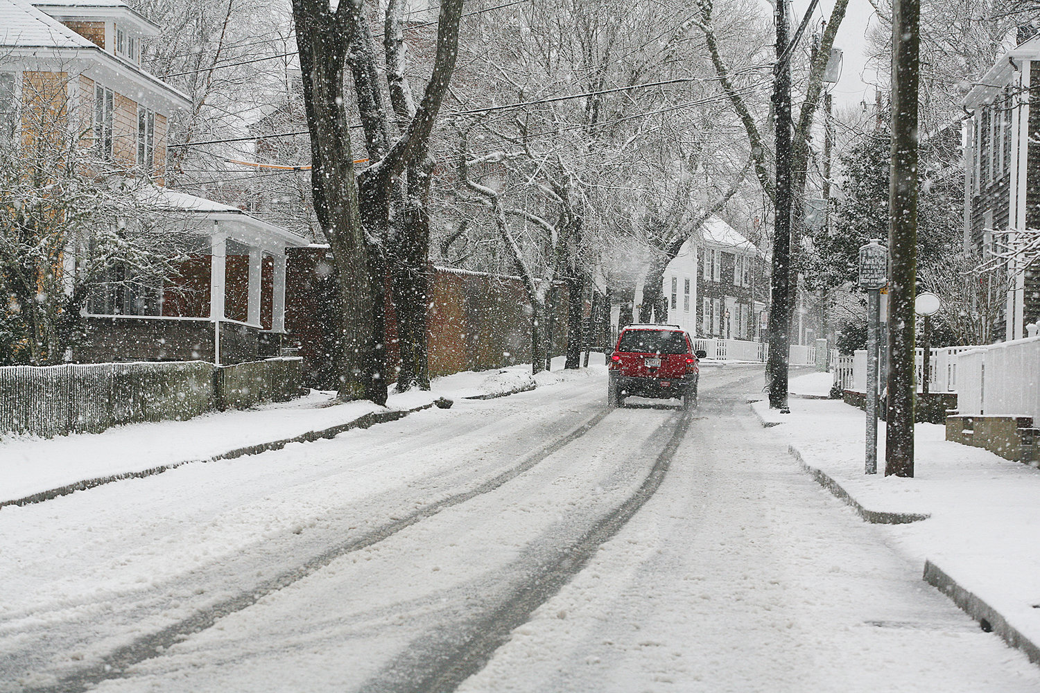 WINTER SCENES -- February 7, 2021 --A vehicle makes it's way along Pleasant Street during Sunday's snow storm.  Photo by Ray K. Saunders