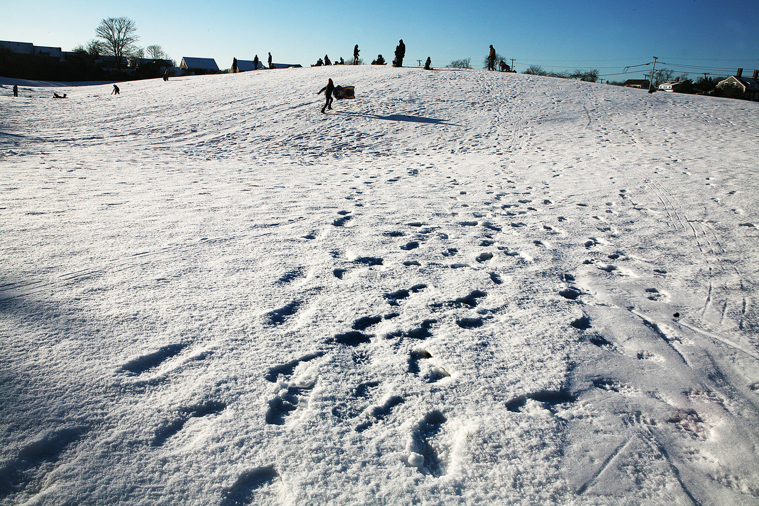 MONDAY, FEBRUARY 8, 2021 -- Footprints in the snow and sledding off Quaker Road on Monday following Sunday's snow storm. Photo by Ray K. Saunders