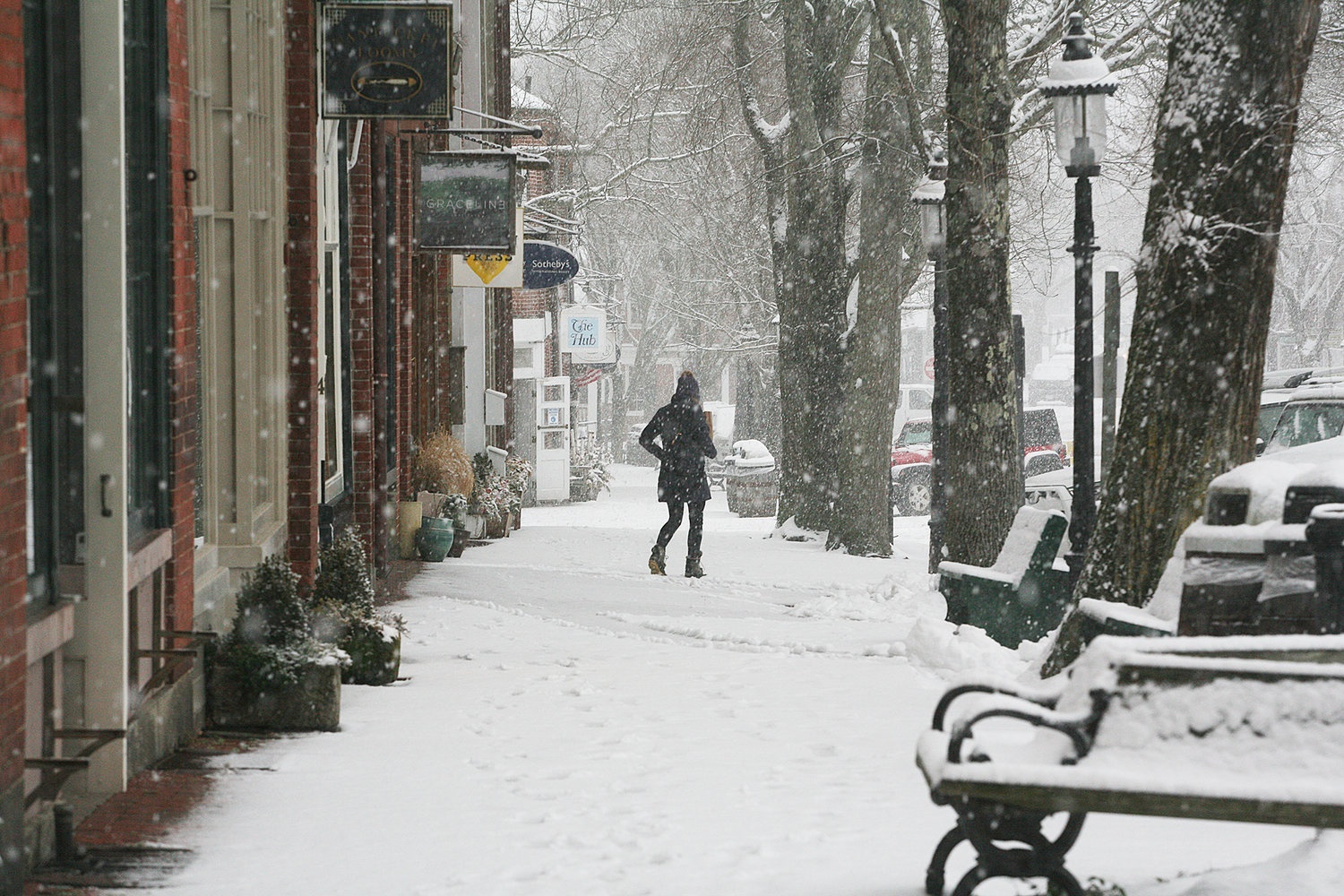 A pedestrian on Main Street during Thursday's snow.