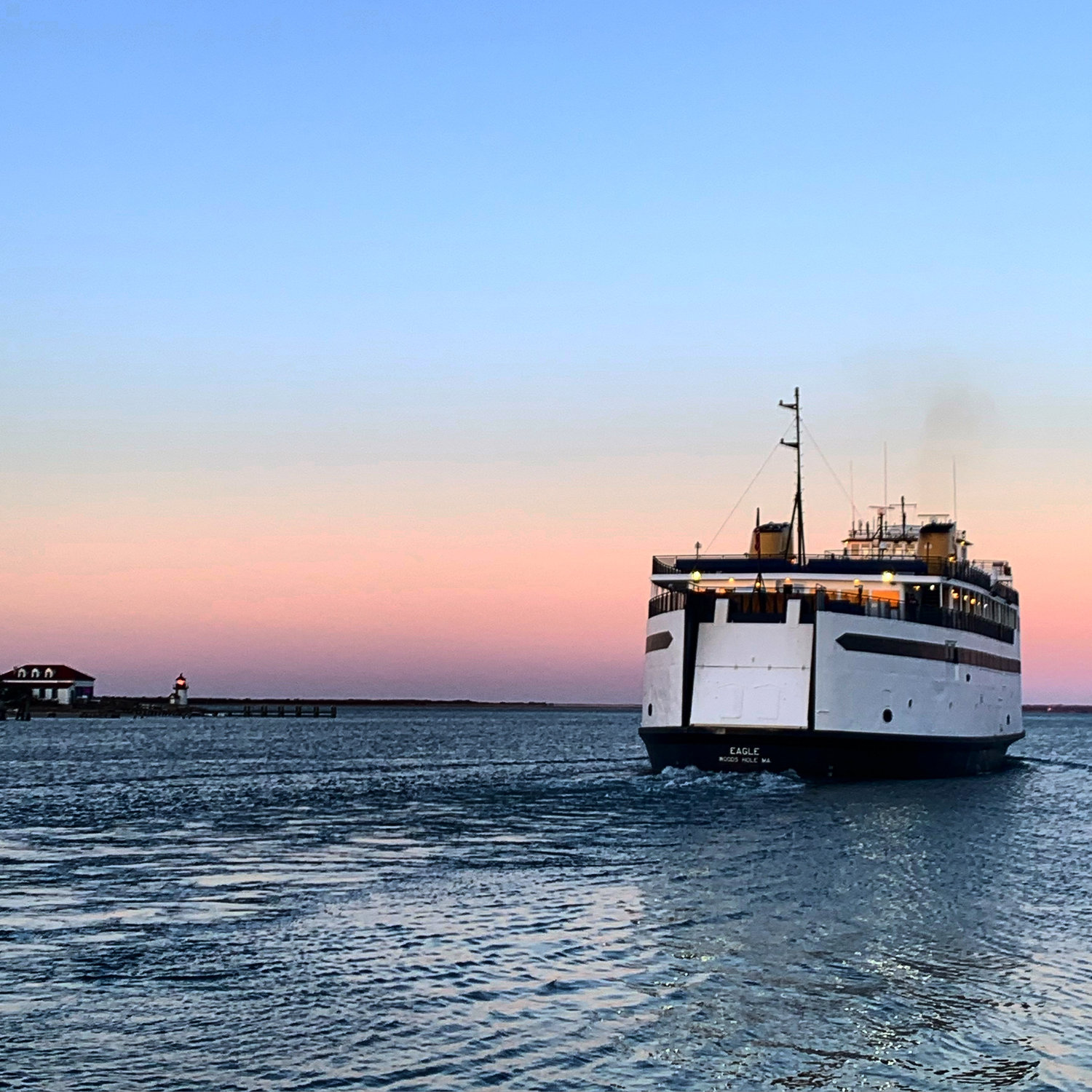 The sun rises over Nantucket Harbor as the M/V Eagle departs for Hyannis.