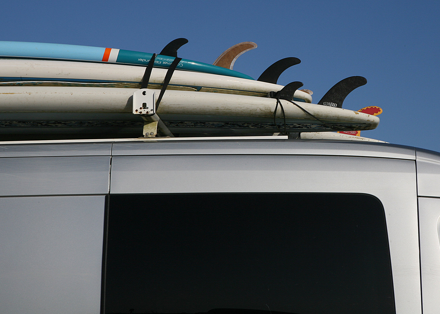 Surfboards atop a vehicle at Cisco Beach on Monday.