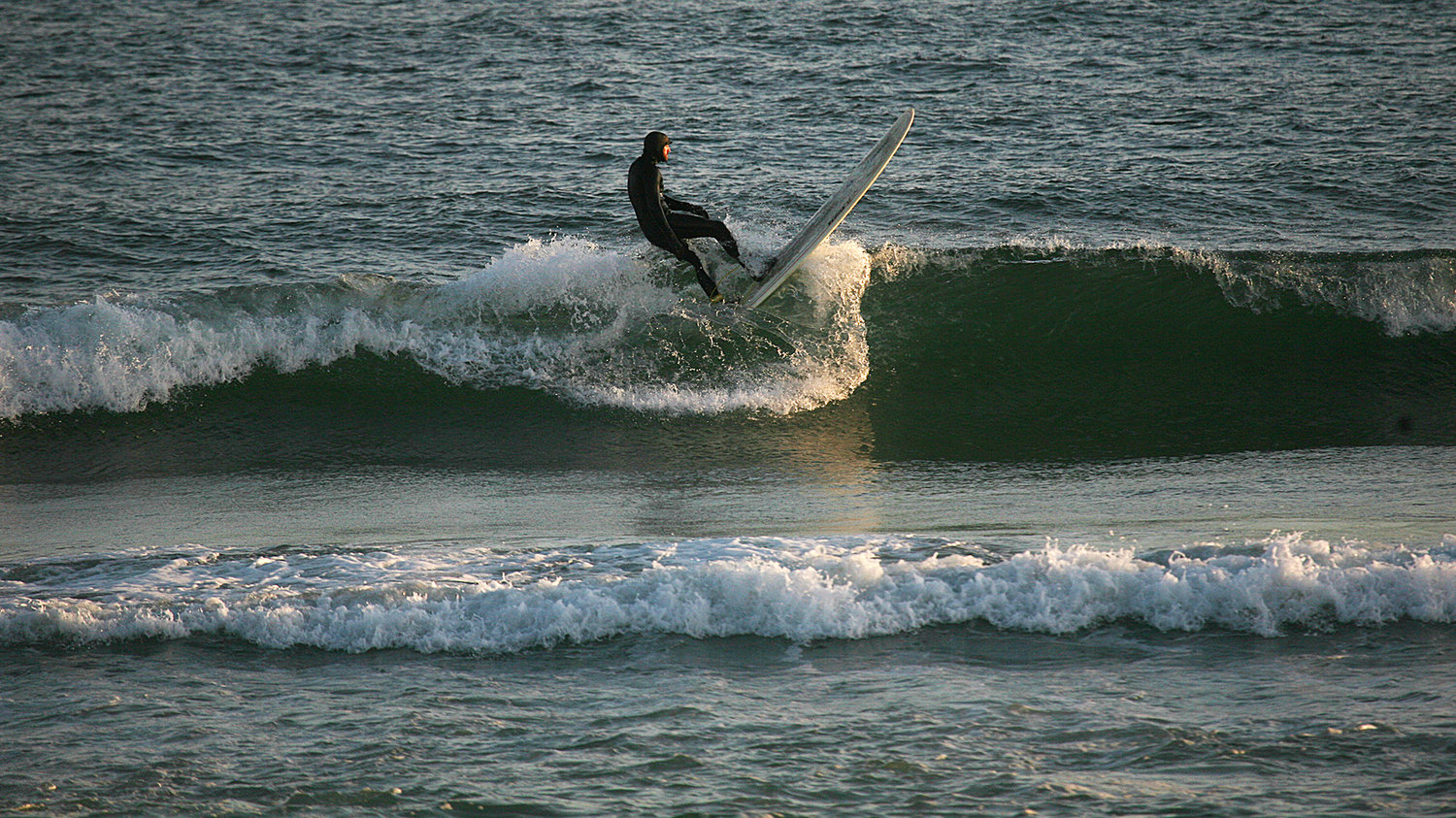 Cameron Marks rides a wave at Cisco Beach on Monday.