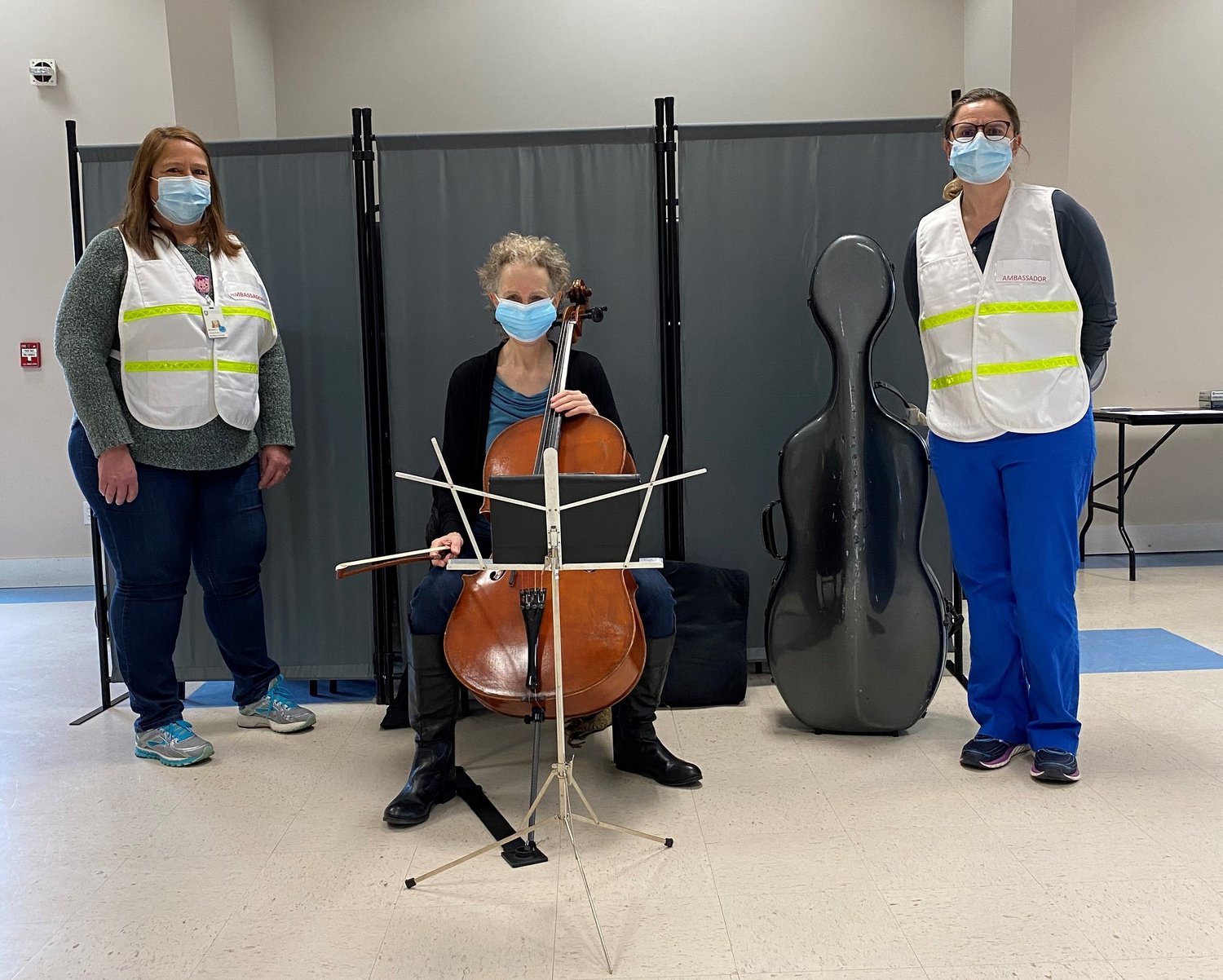 Cellist Mollie Glazer with Nantucket Cottage Hospital staff members Michele Cranston and Suzanne Carroll at the New South Road VFW vaccination site March 1.