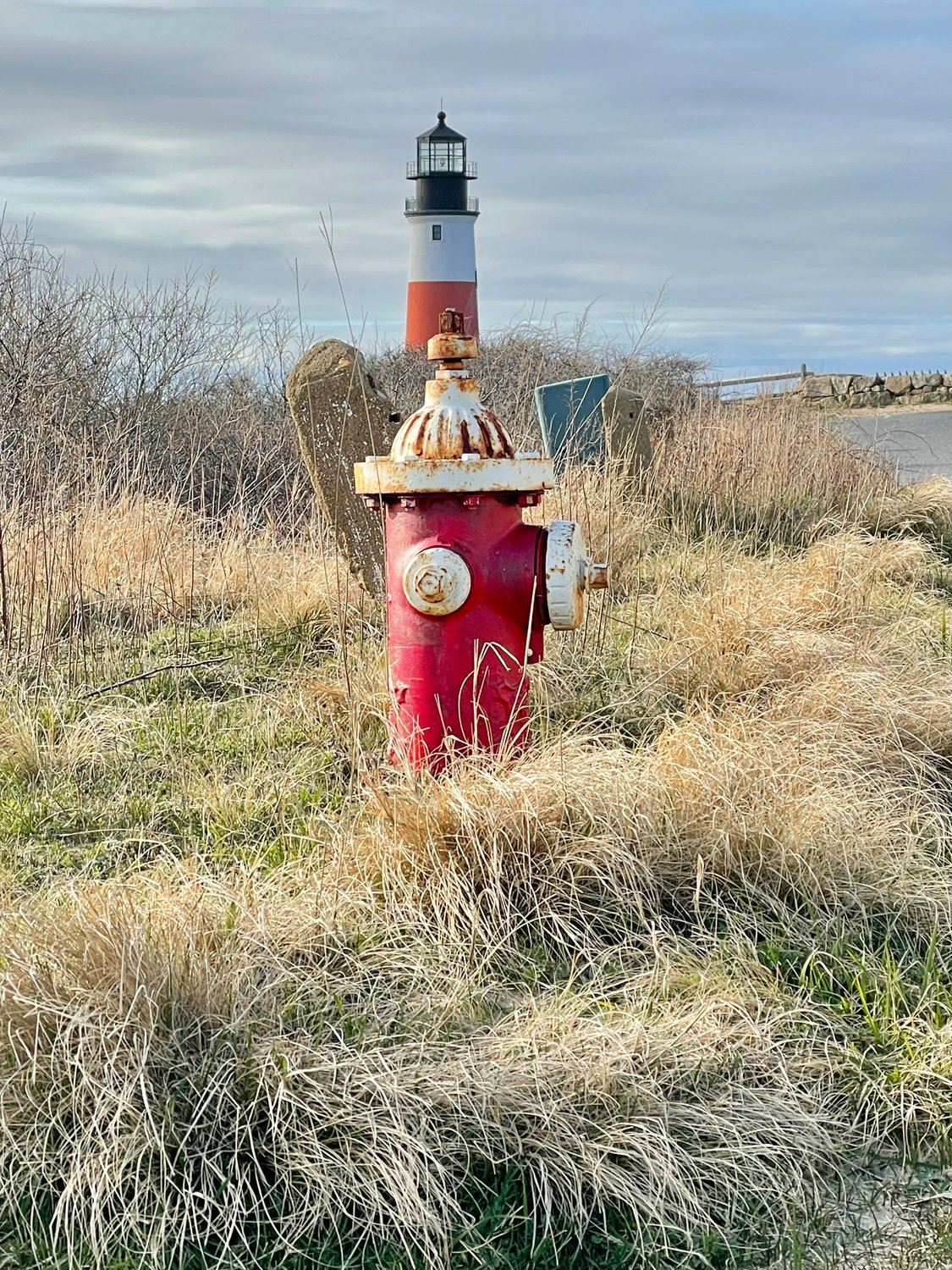 Sankaty Head Light with a fire hydrant in the foreground.