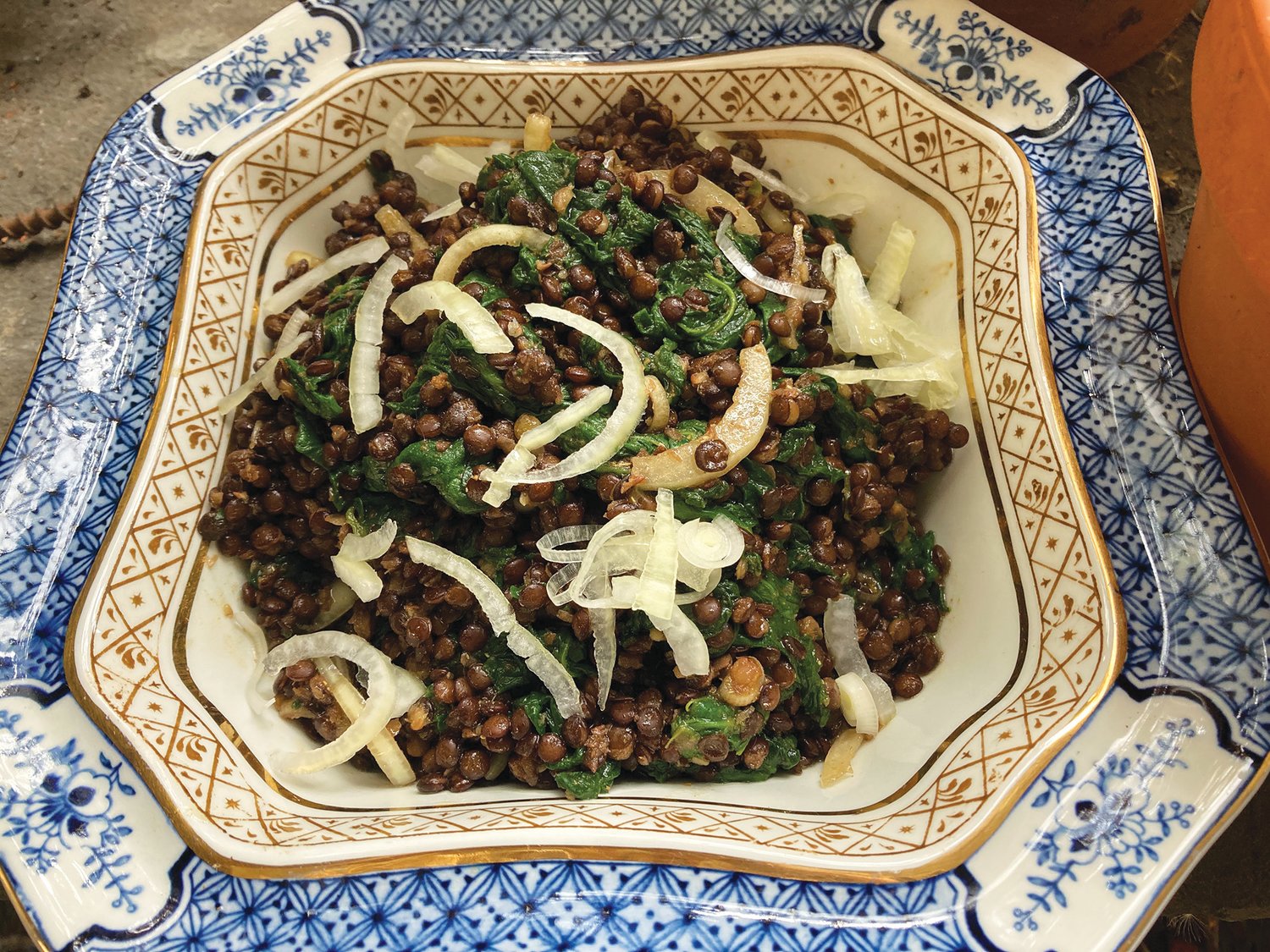Lentils and spinach with onions and cumin vinaigrette.