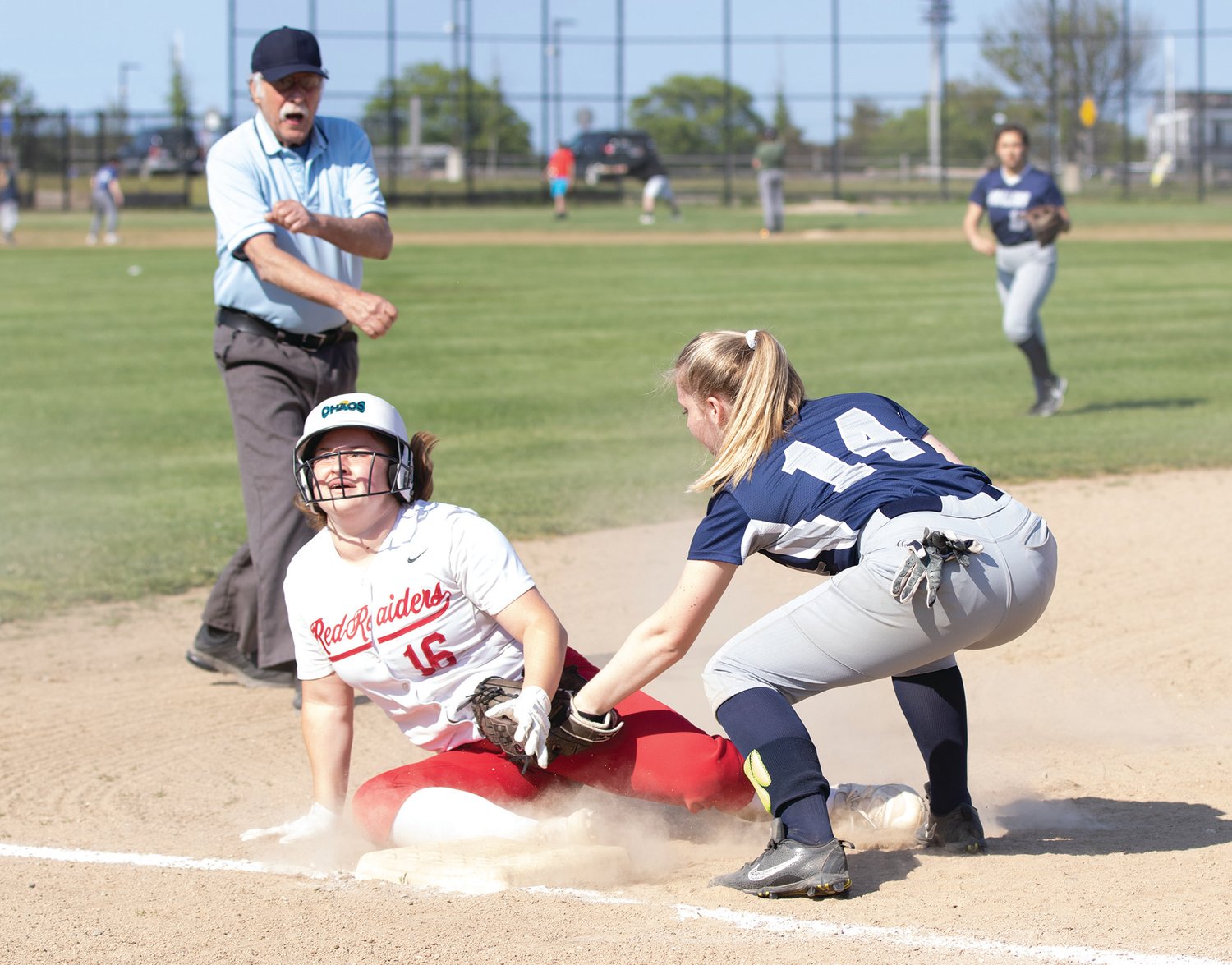Quincy Sullivan tags a girl out at third to end the inning against Barnstable