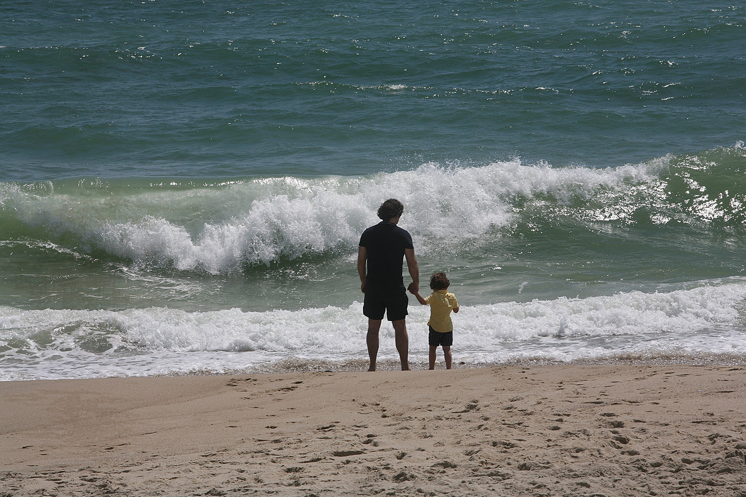 Theodore Pirneas and his 3-year-old son Yianni of New Hampshire enjoy the surf at Madaket Beach.