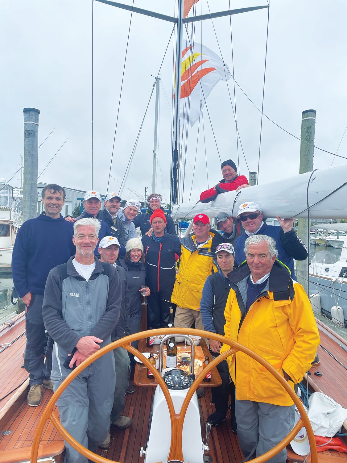 Harvey Jones, front right, and the crew of his 55-foot wooden sailboat Outlier, which won the 2021 Figawi race in the waters off Hyannis Sunday. The race did not come to Nantucket this year due to COVID-19 concerns, and was postponed a day due to high winds.