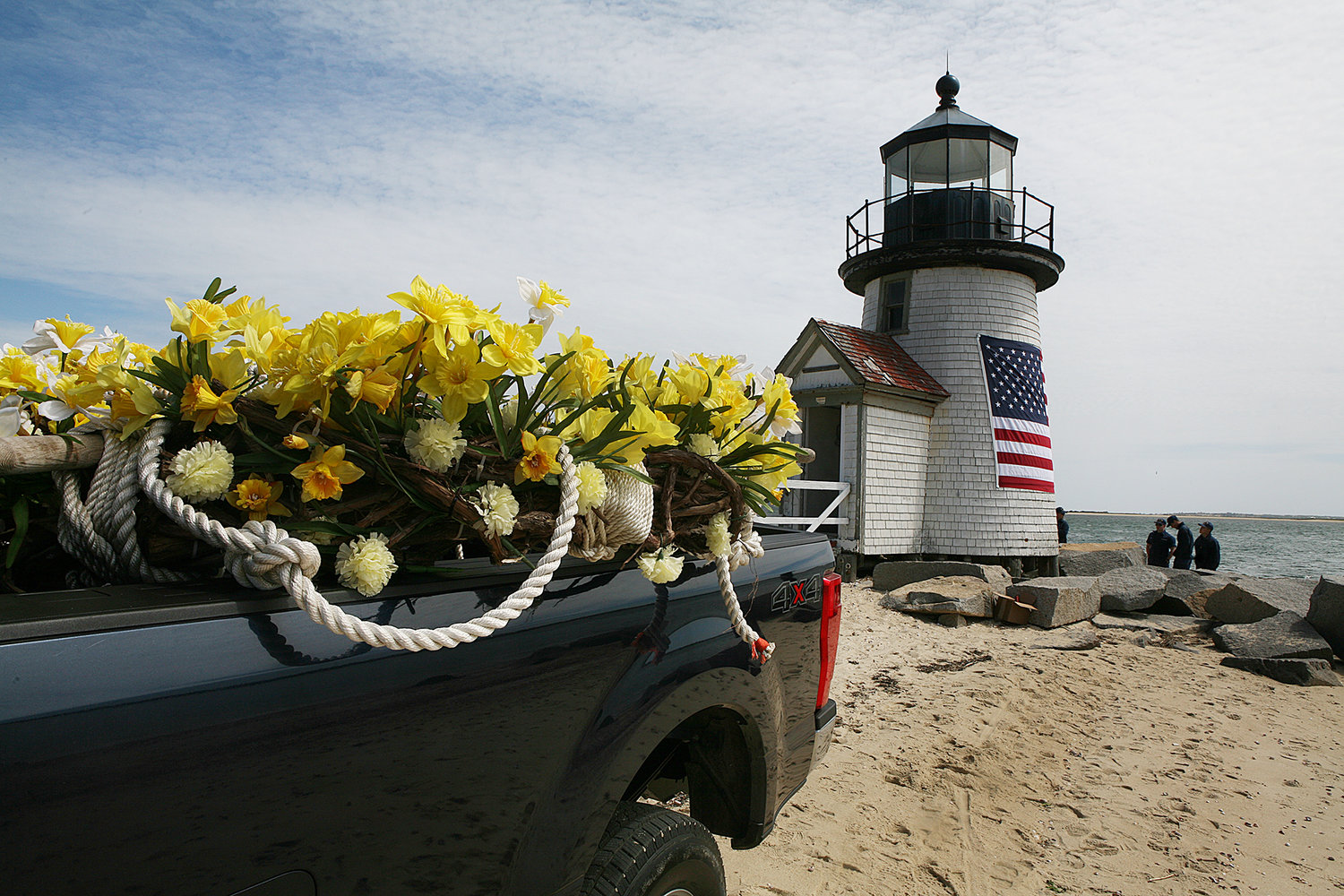 MAY 28, 2021 -- The daffodil wreath is in the back of a truck after a crew from the US Coast Guard Station Brant Point took down the daffodil wreath and replaced it with a flag in honor of Memorial Day and the Fourth of July at the Brant Point lighthouse.
