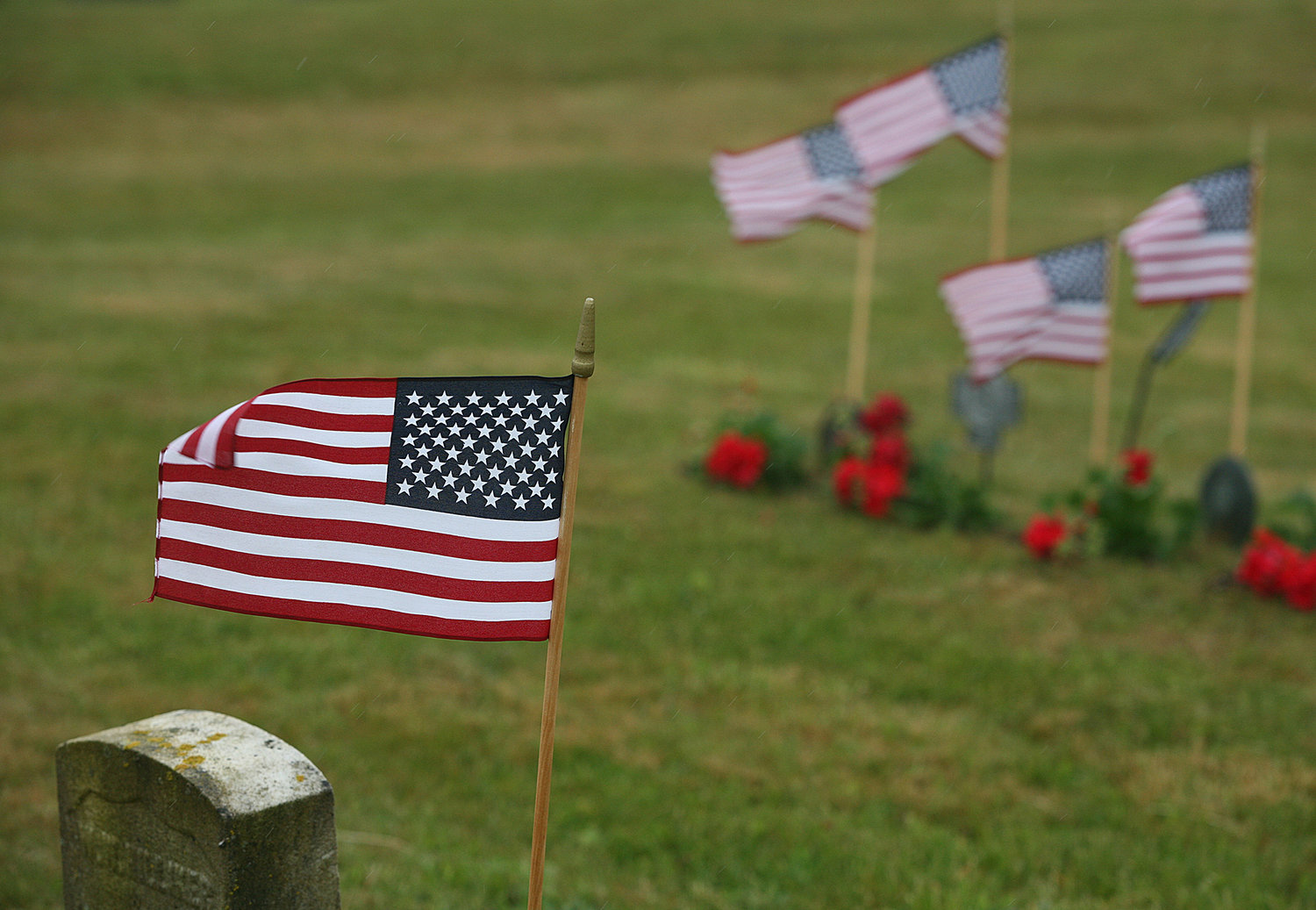 Memorial Day Ceremony at Prospect Hill Cemetery. Flags decorate gravesites.