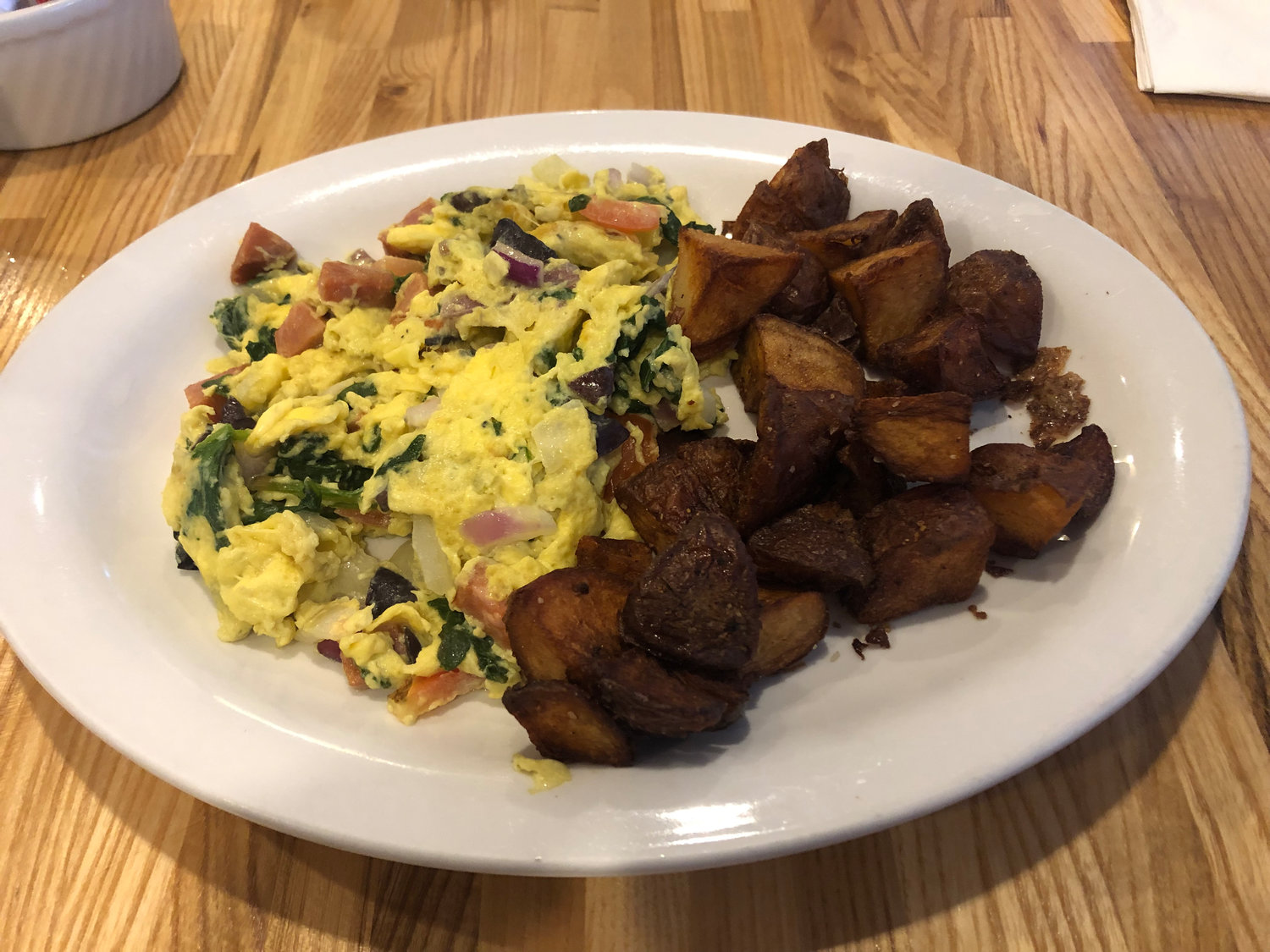 The meat-lovers omelet, with a side of toast and crispy home fries, is just one of the breakfast classics on the menu at Crosswinds at the airport.