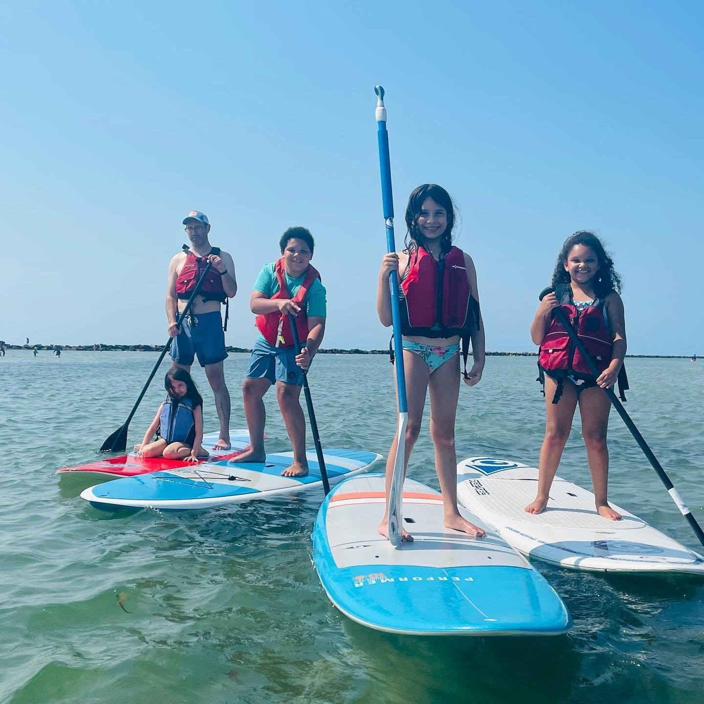 Paddle-boarding on the Fourth. From left, Matt Mannino, Cecily Mannino, Kai Graves, Lucia Mannino and Mia Graves.