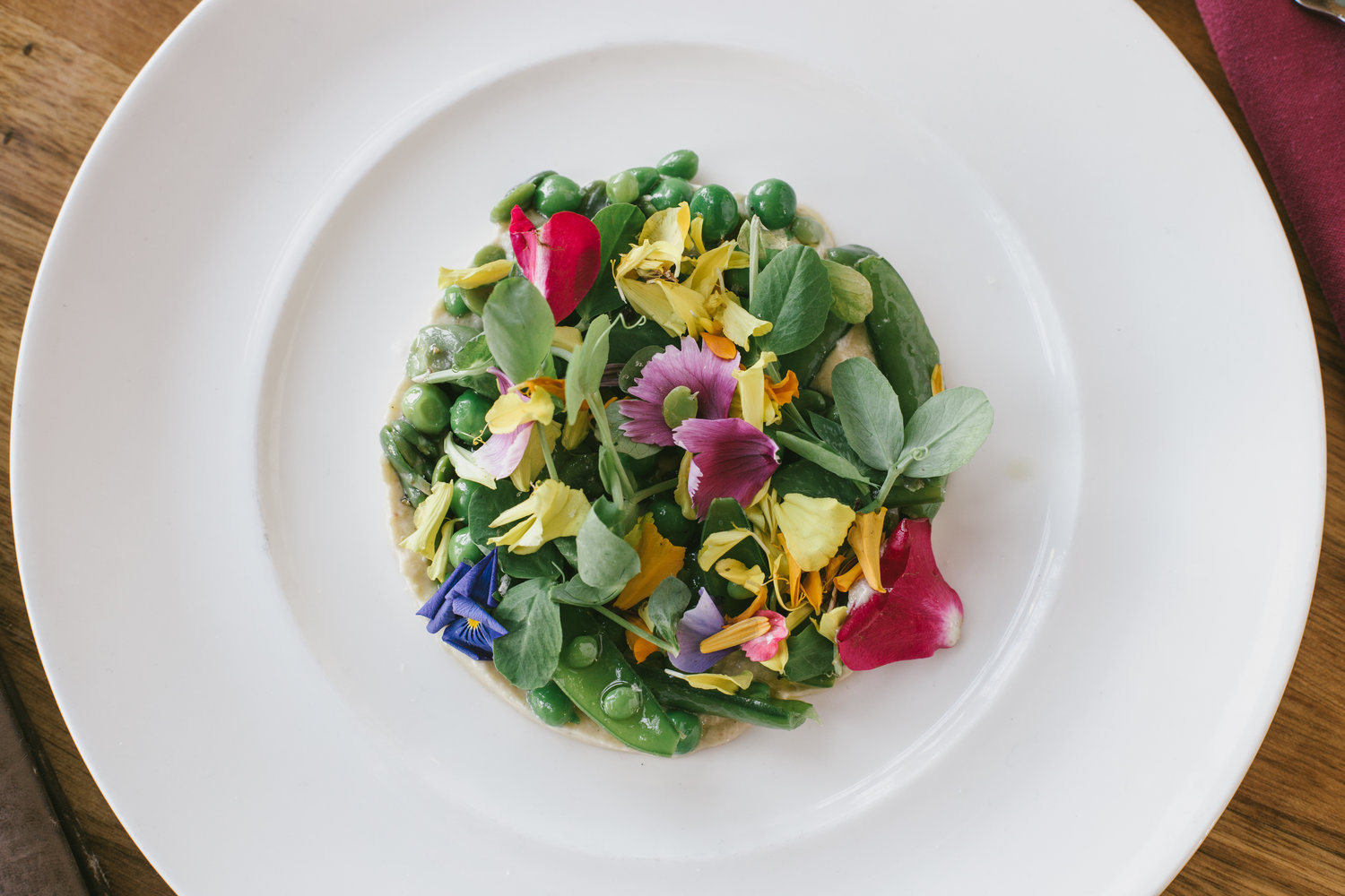 The spring pea crudité with fava beans, summer squash and sunflower baba ghanoush.