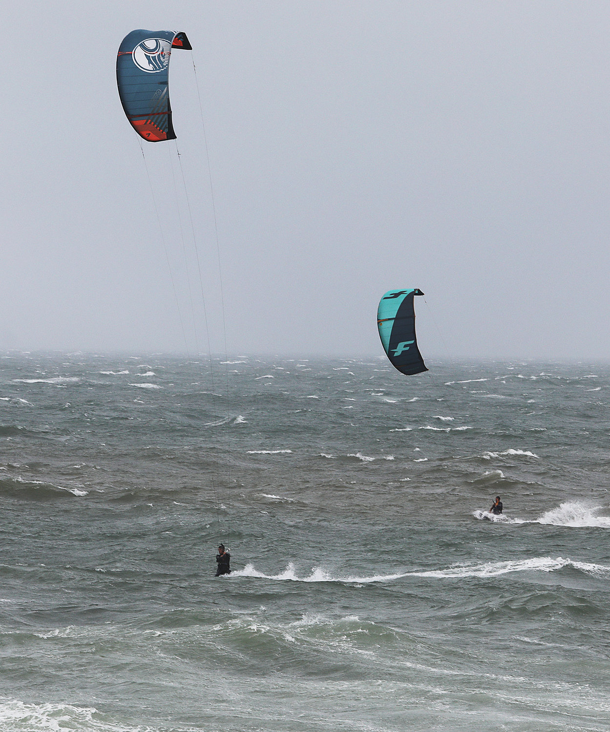 Kite surfers take advantage of the surf kicked up by Tropical Storm Elsa at Cisco Beach Friday, July 9.