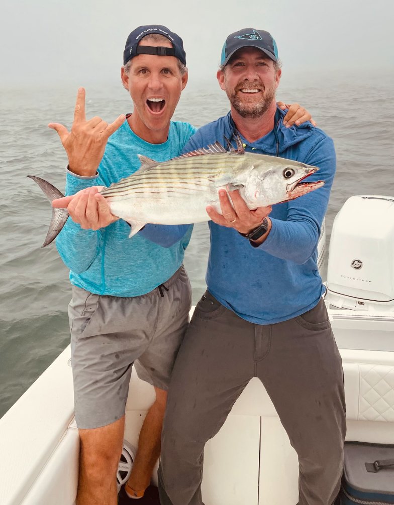 Sam and Gus Davidson with a bonito they caught on the east side of the island this week.