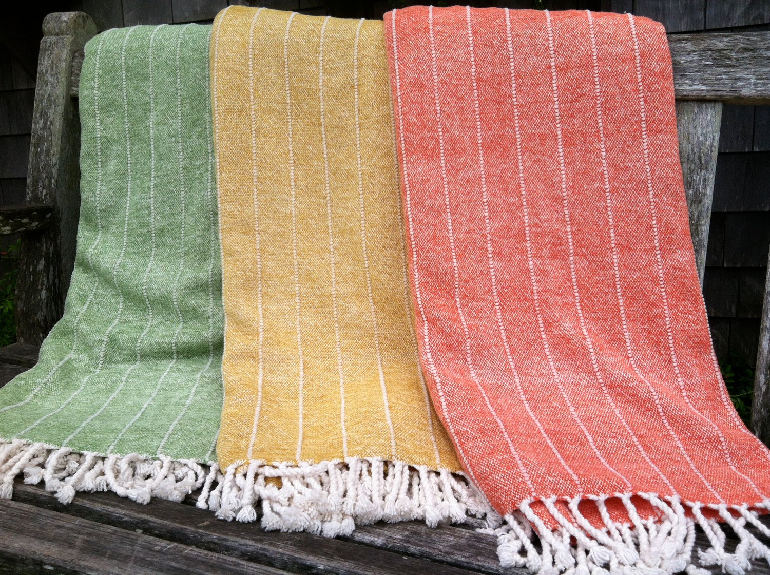 A brightly-colored array of Karin Sheppard’s popular throws.