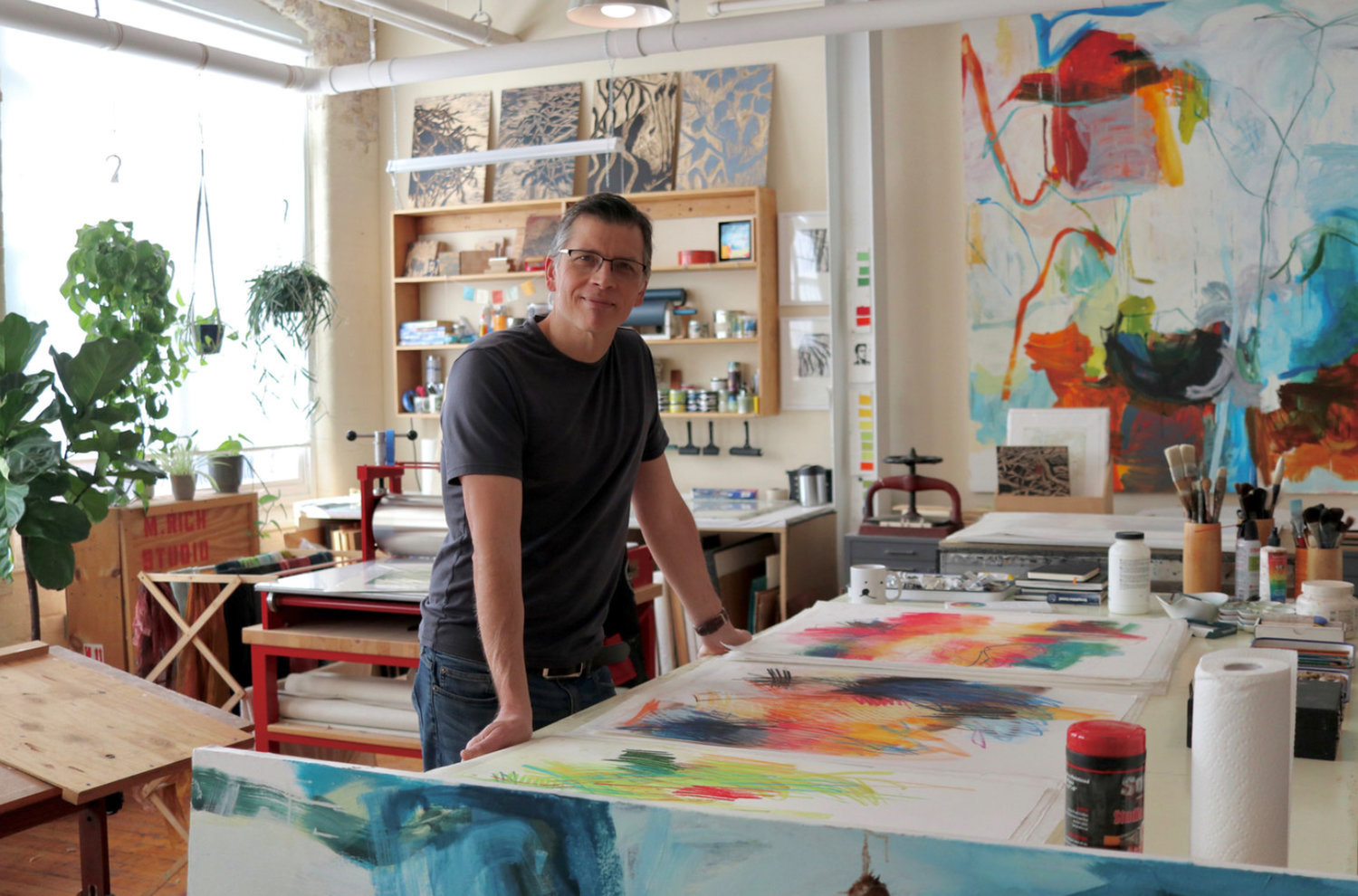 Abstract painter Michael Rich at his studio in Rhode Island. The Hostetler Gallery on Centre Street will host an opening reception for an exhibit of his work tomorrow at 5 p.m.