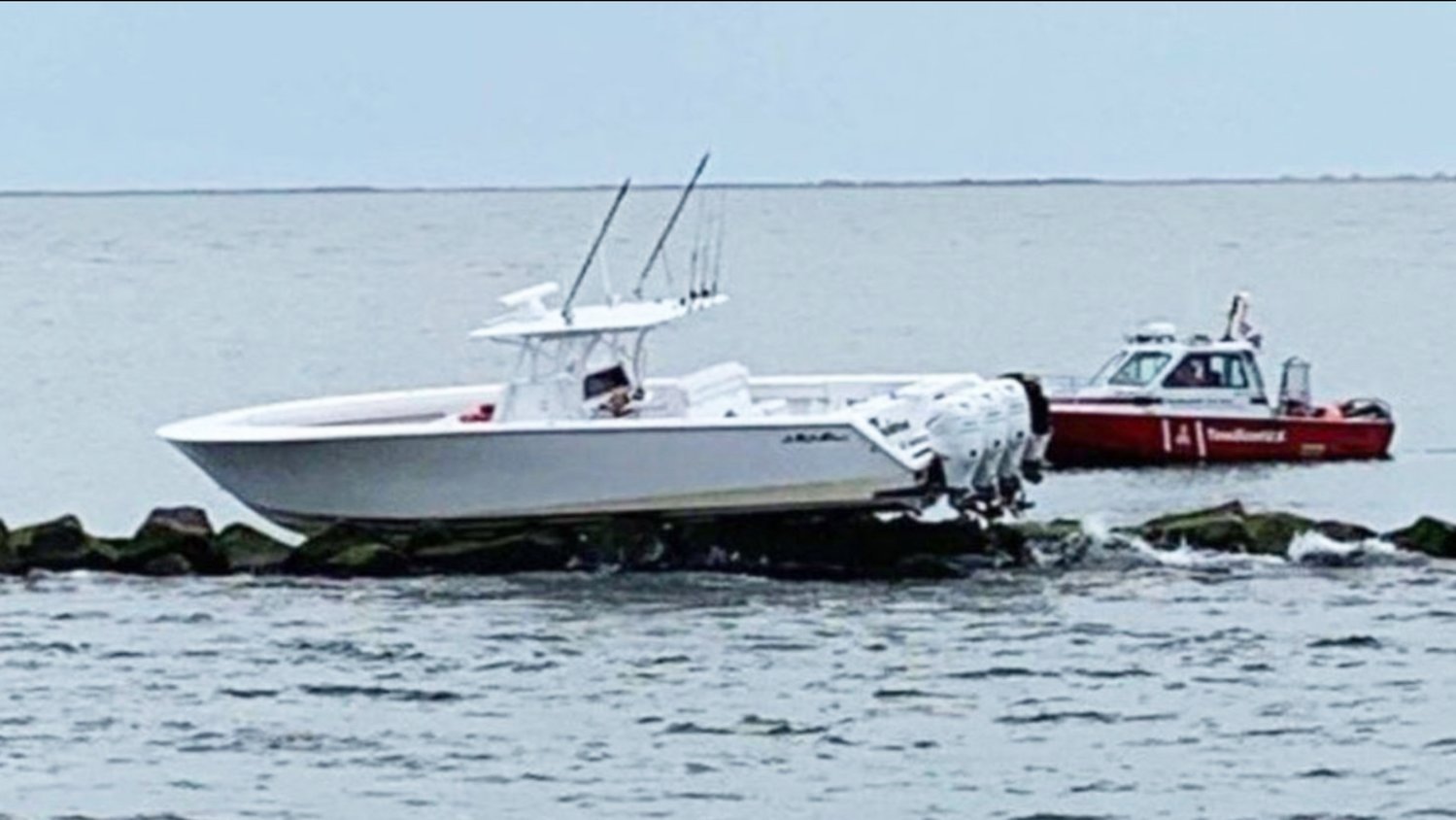 This 41-foot center console powerboat ran aground on the east jetty Saturday night.