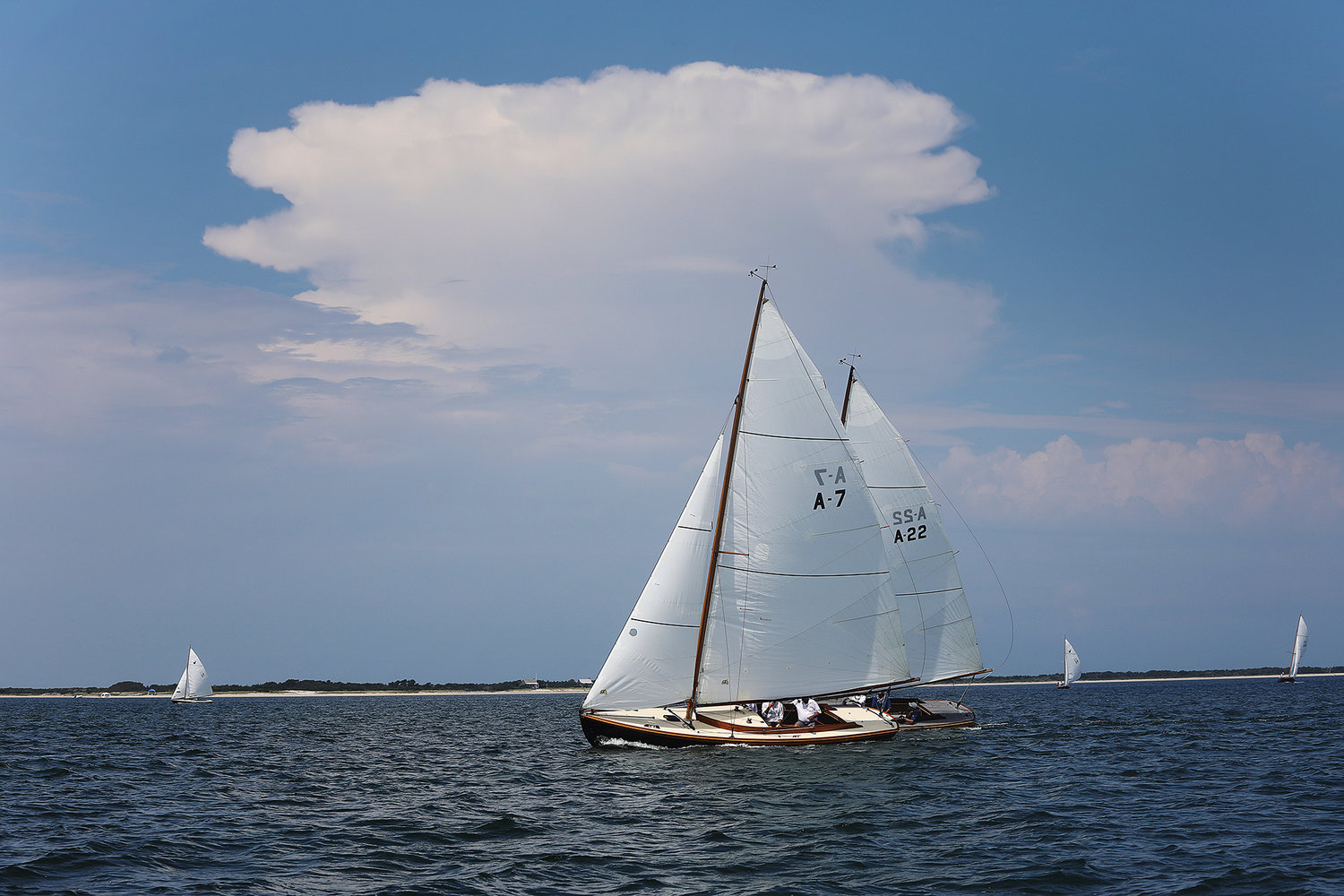 Java (A7) captained by Harvey Jones and Second Wind compete in the Alerion division of the One Design Regatta in Nantucket Harbor on the opening day of Race Week 2021.