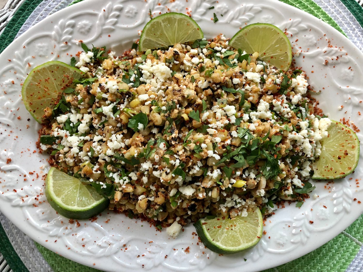 The kernels in this Mexican Corn Salad with cilantro and lime are blistered in a hot wok, rather than over a charcoal grill.