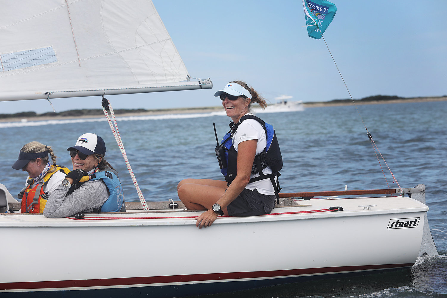 Ashley Mason has the tiller sailing with fellow crew members Amy Baldwin and Sue McCollum during the 2021 Women's Regatta in the harbor on Wednesday.