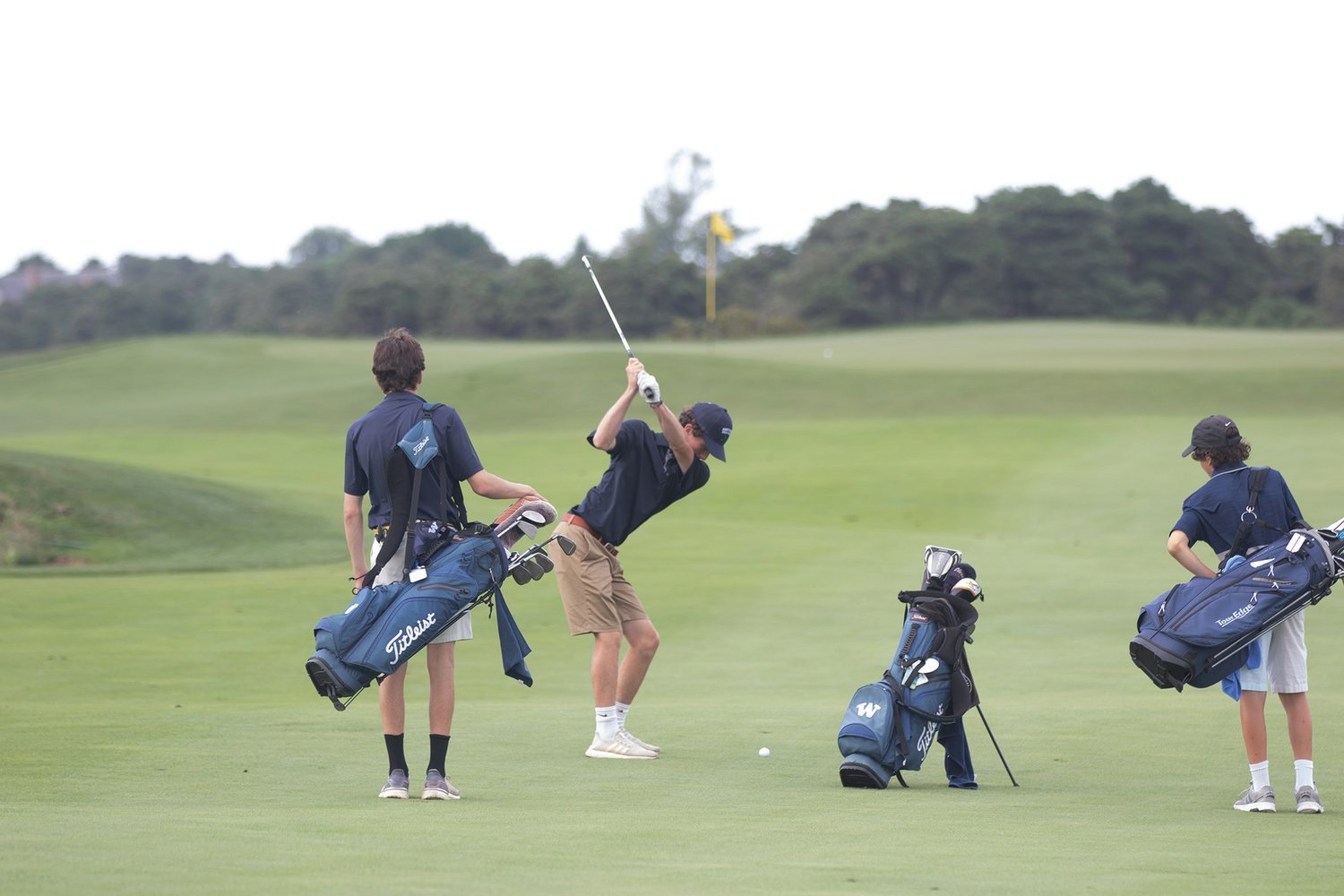 Griffin Starr prepares to hit a shot from the fairway on the back nine at Miacomet in Nantucket’s season-opening 4-3 win over Cape Cod Academy Tuesday.
