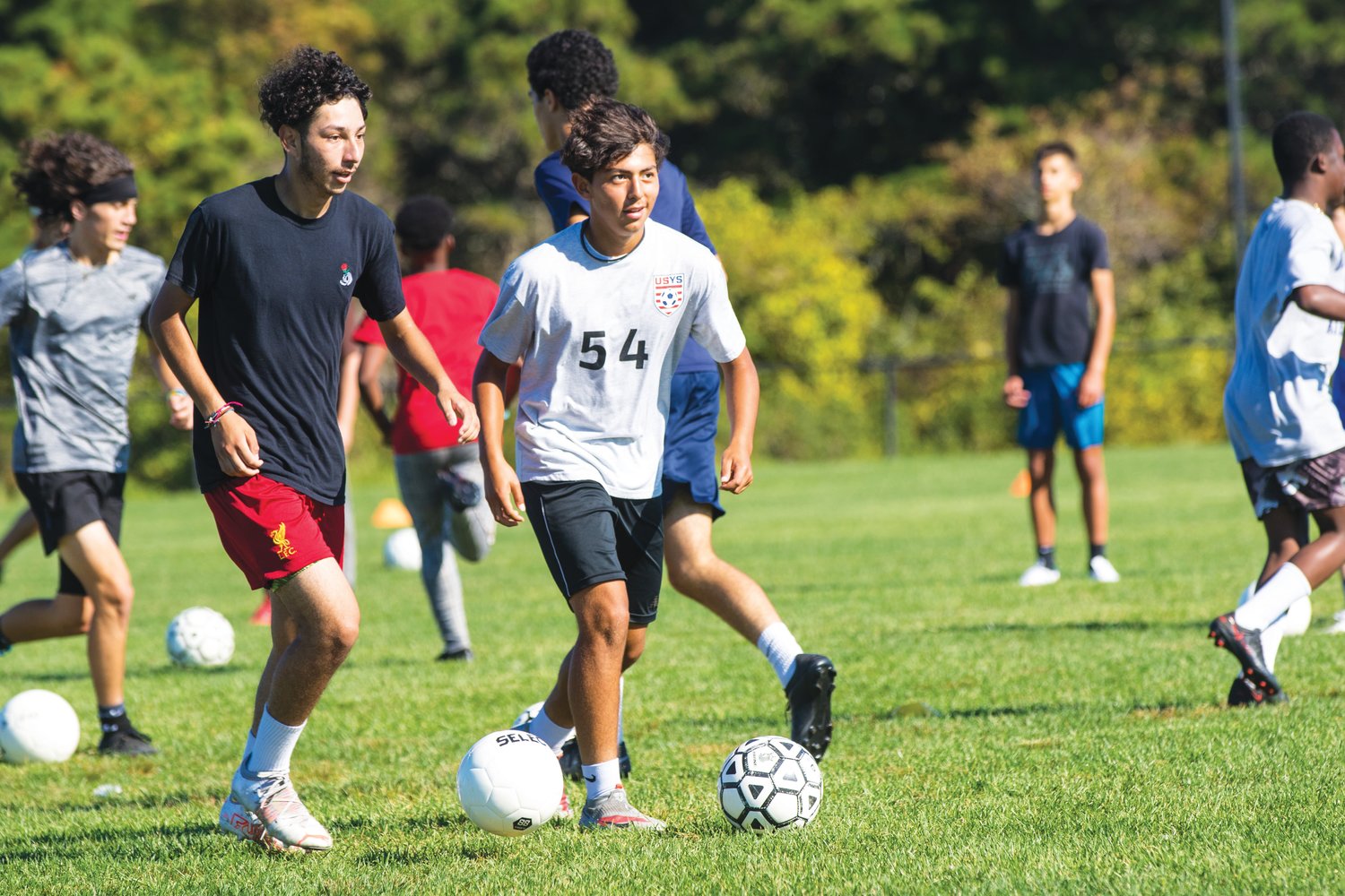 Alejandro Chacon and Jose Aguilar during boys soccer practice drills at Nantucket High School Tuesday.