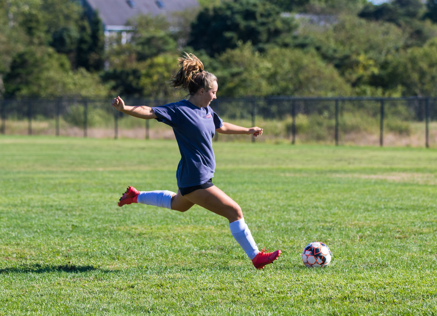 Emery Quinn lines up a kick during girls soccer practice Tuesday.