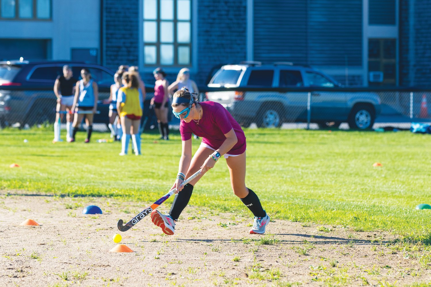 Maddie Lombardi maneuvers with the ball during drills at field hockey practice Tuesday.