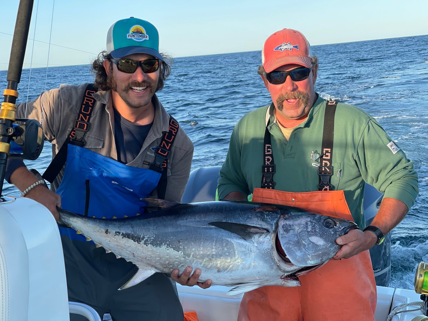 Chris and Dave Bell with a tuna they caught east of the Island.