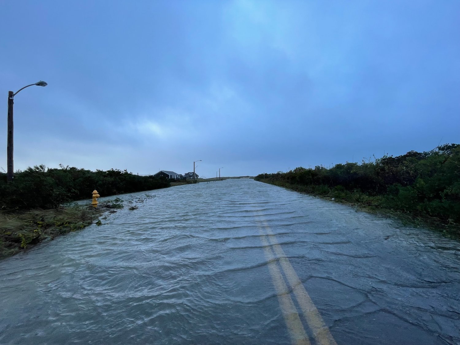 Bathing Beach Road leading to Jetties Beach was flooded Wednesday morning.