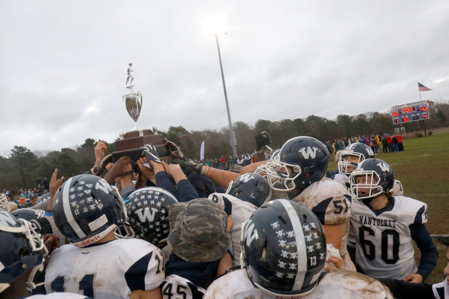 The Whalers celebrate winning the 2019 Island Cup 47-20 on Martha’s Vineyard, the last time the game was played. This year the game is on Nantucket, Saturday at 2 p.m.