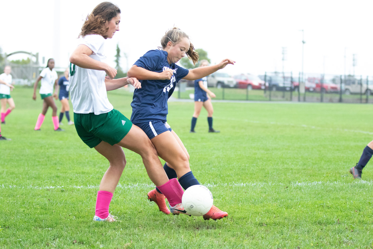 Cydney Mosscrop, right, battles for a loose ball earlier this season against Dennis-Yarmouth. The Whalers lost the first matchup 2-1 but rebounded to win the second meeting 3-1.
