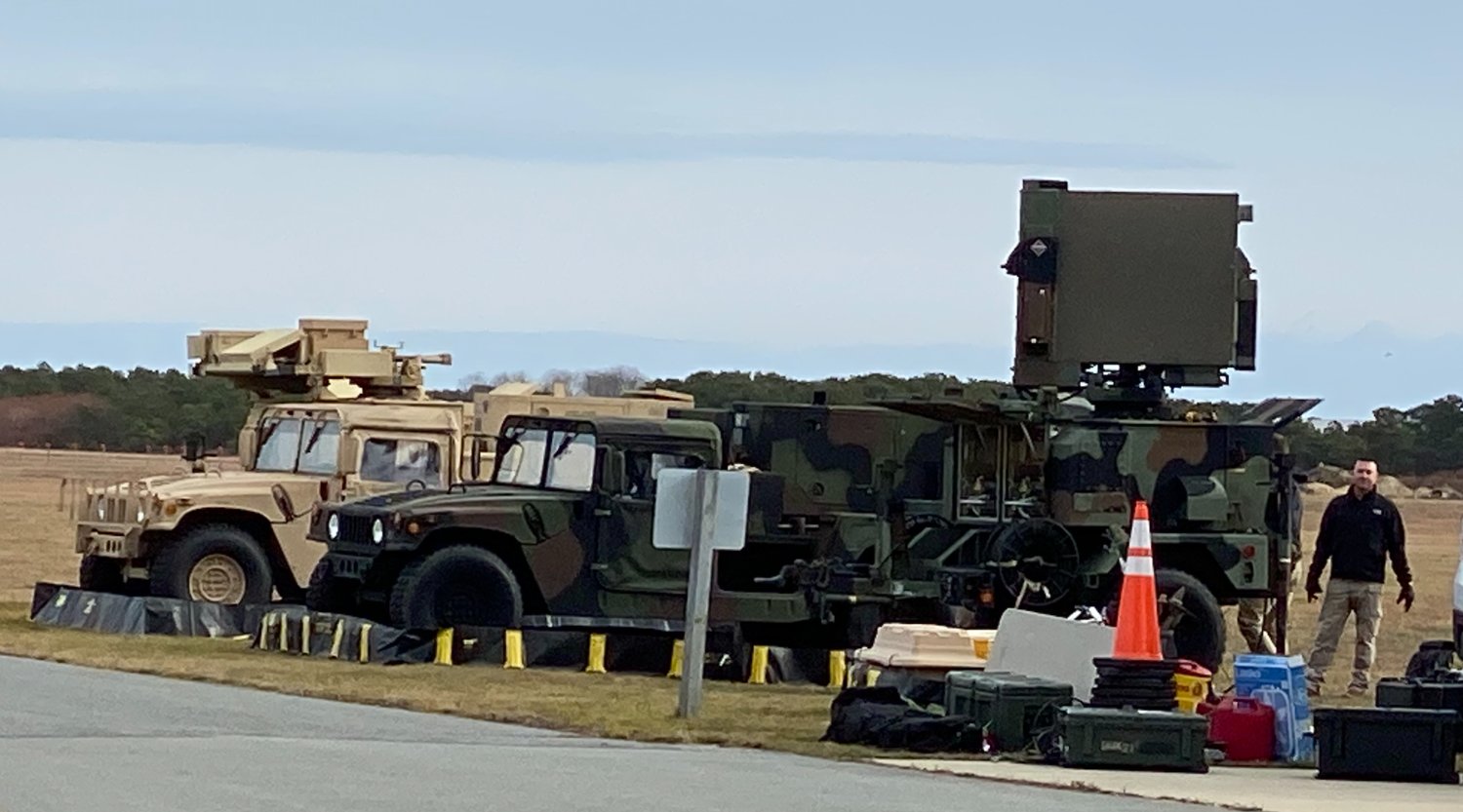 Military vehicles and equipment staged at Nantucket Memorial Airport Sunday morning.