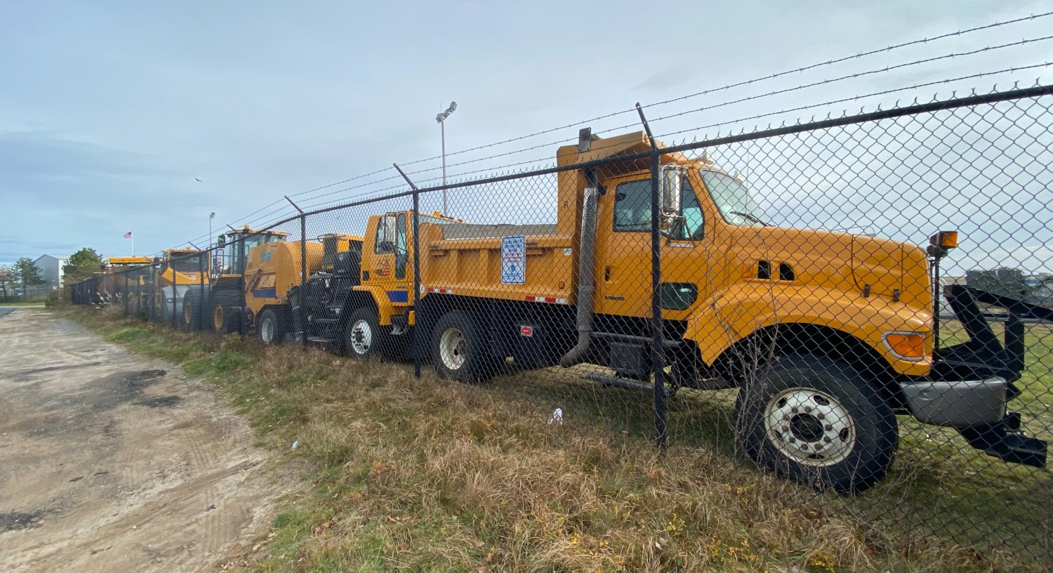 Nantucket Memorial Airport heavy equipment lines the permiter fence Sunday morning.