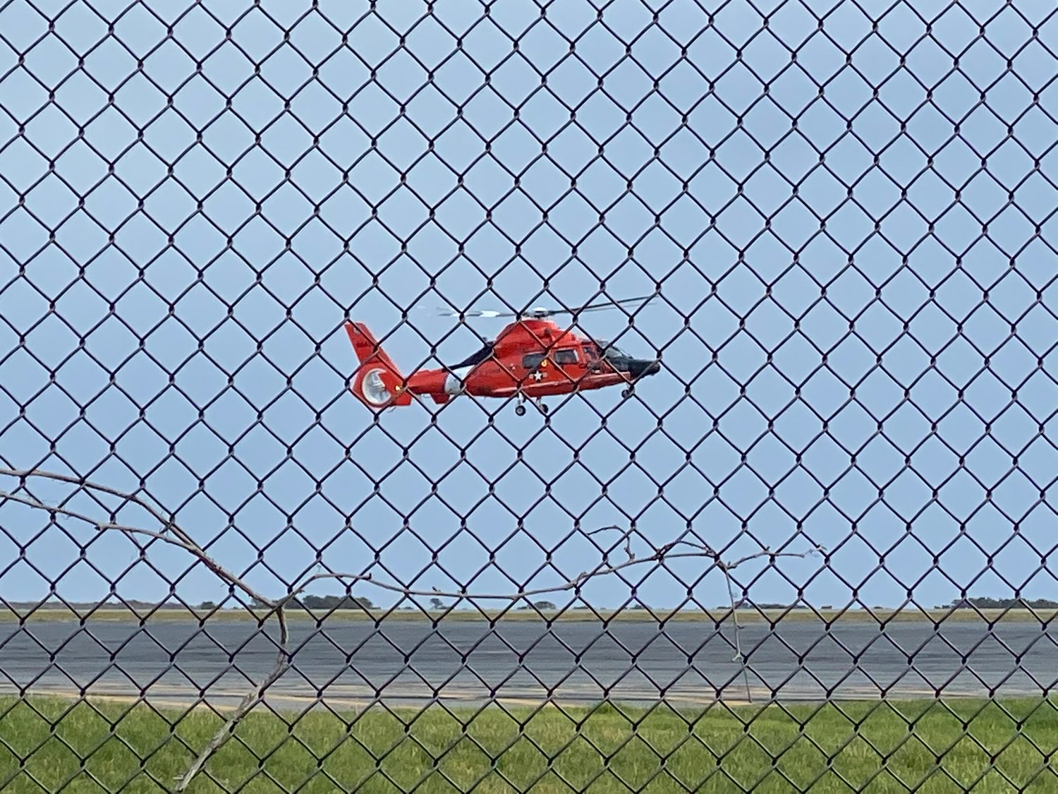 A U.S. Coast Guard helicopter lands at Nantucket Memorial Airport Sunday afternoon.