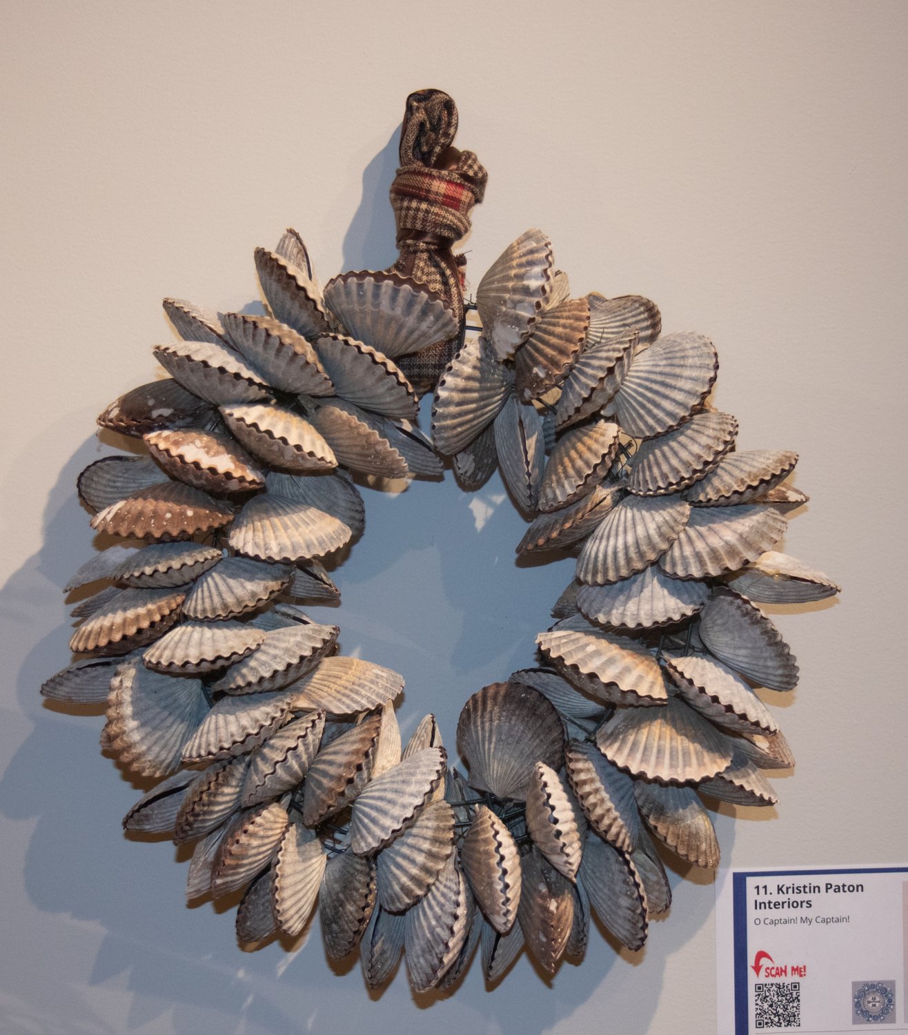 A wreath by Kristin Paton Interiors up for auction in the Nantucket Historical Association's annual Festival of Wreaths at the whaling museum.