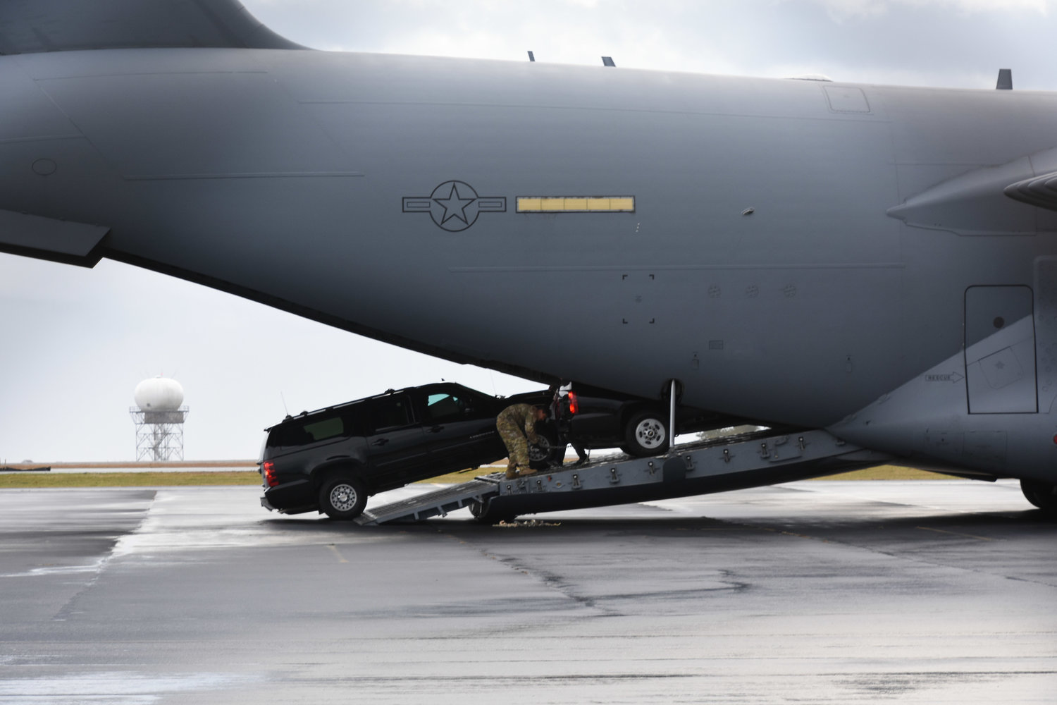 Vehicles are unloaded from a U.S. Air Force C-17A Globemaster cargo plane at Nantucket Memorial Airport Monday morning.