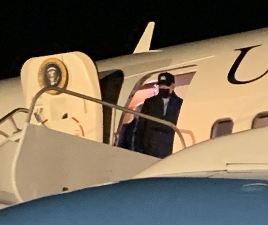 President Joe Biden deplanes from Air Force One at Nantucket Memorial Airport Tuesday night.