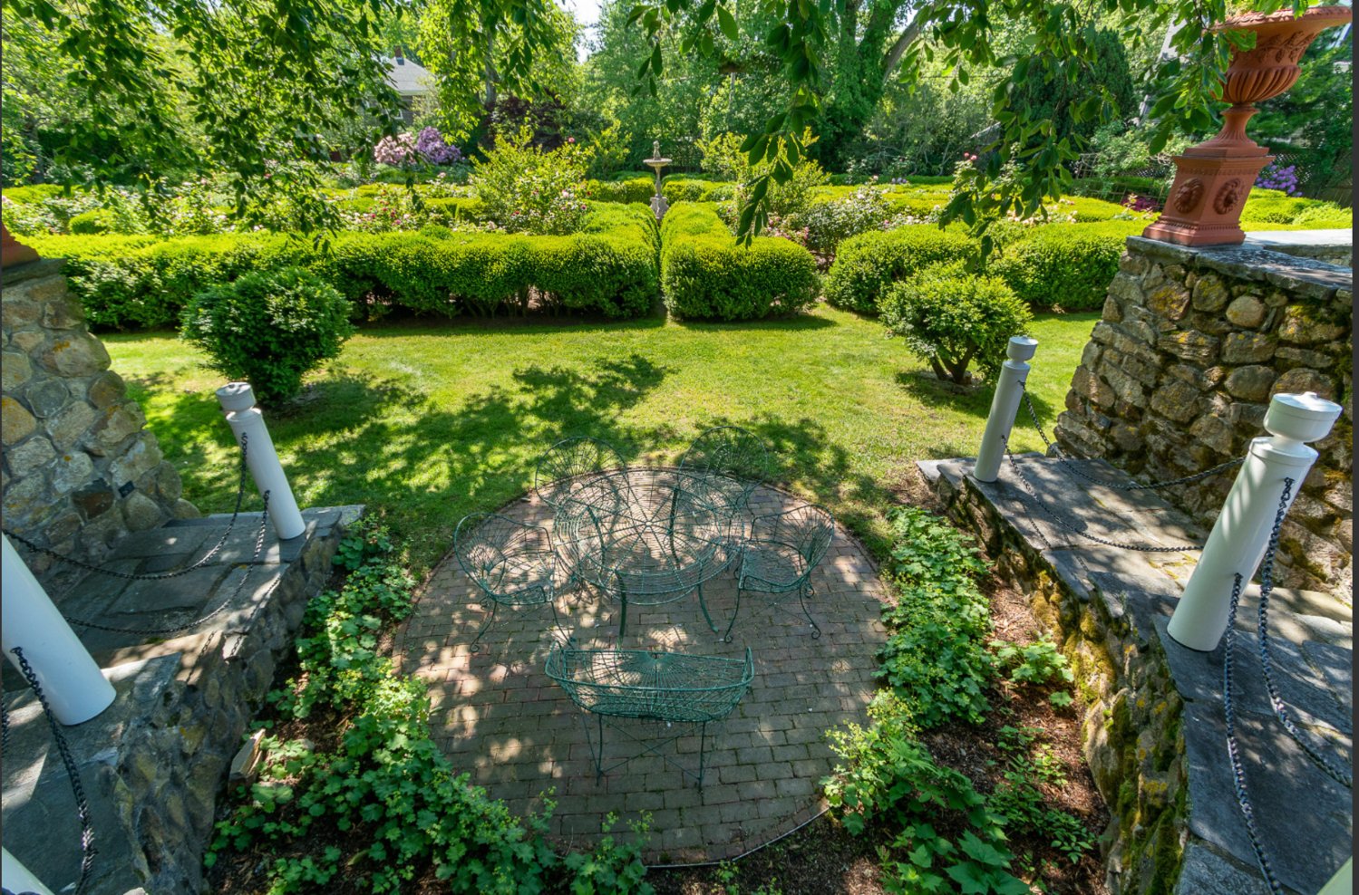 The formal gardens are surrounded by a brick wall to provide the utmost privacy.