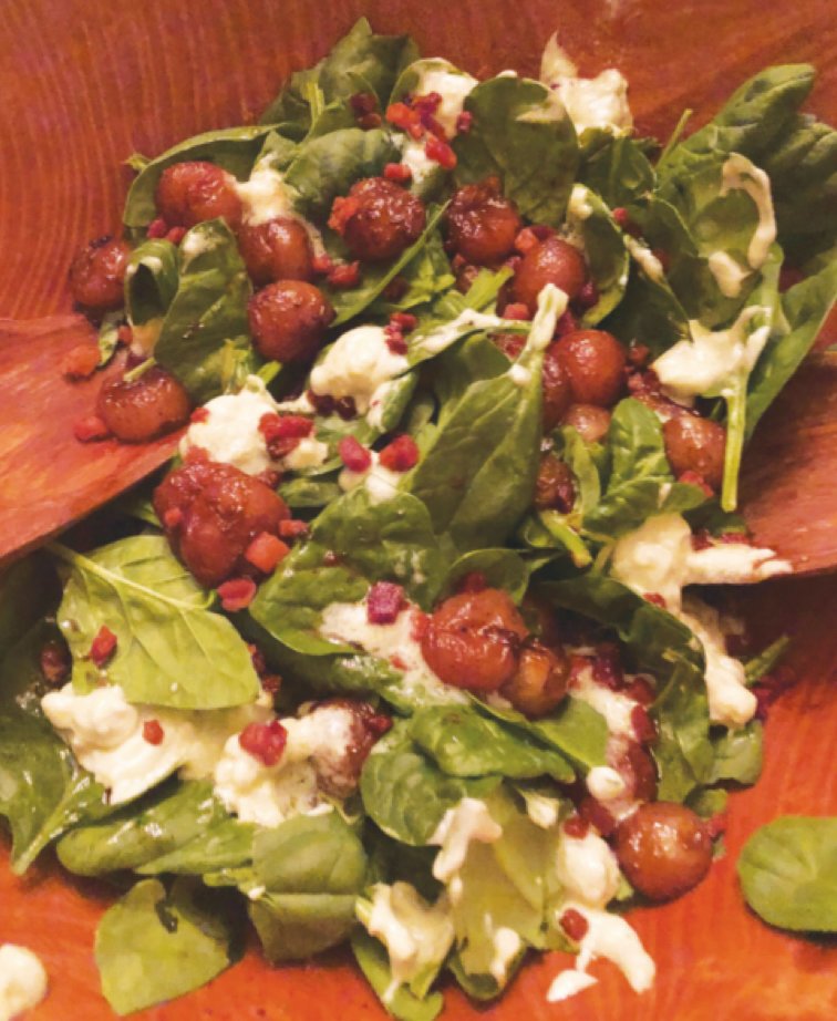 Spinach and grape salad with roquefort dressing.