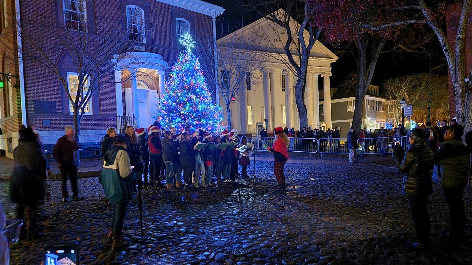 More than 1,000 people attended Friday's tree-lighting and community caroling.
