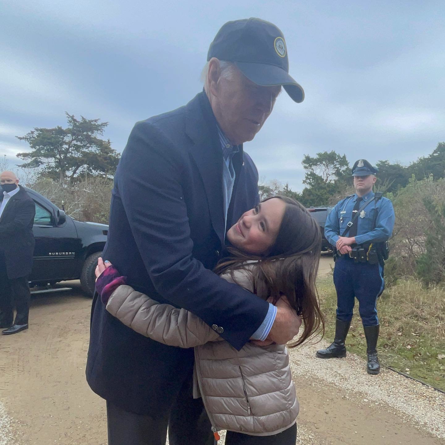 President Joe Biden hugs Avery Nigrelli, 9, before leaving for Nantucket Memorial Airport Sunday.