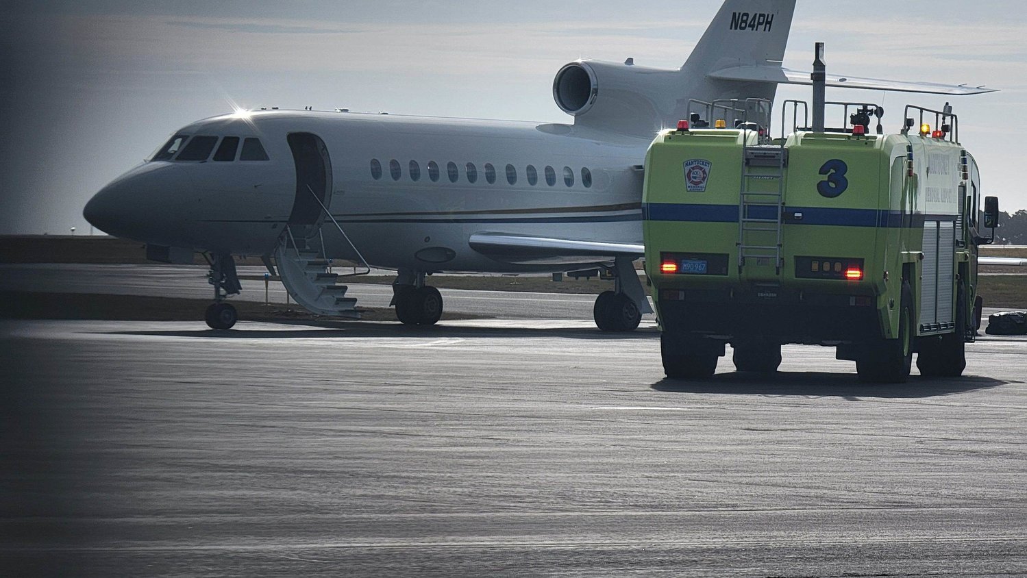This Dassault Falcon 900 was evacuated on the tarmac at Nantucket Memorial Airport Thursday after a possible fire was reported in the baggage compartment.